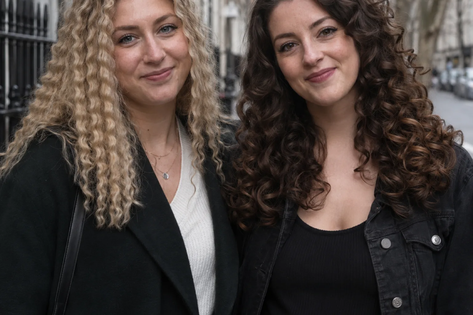 A woman with blonde crimped hair beside a woman with rounded dark brown curls, showing the angular and rounded patterns side by side